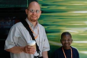 Yours truly with Gary Coleman in front of a large, weirdly marked vehicle.